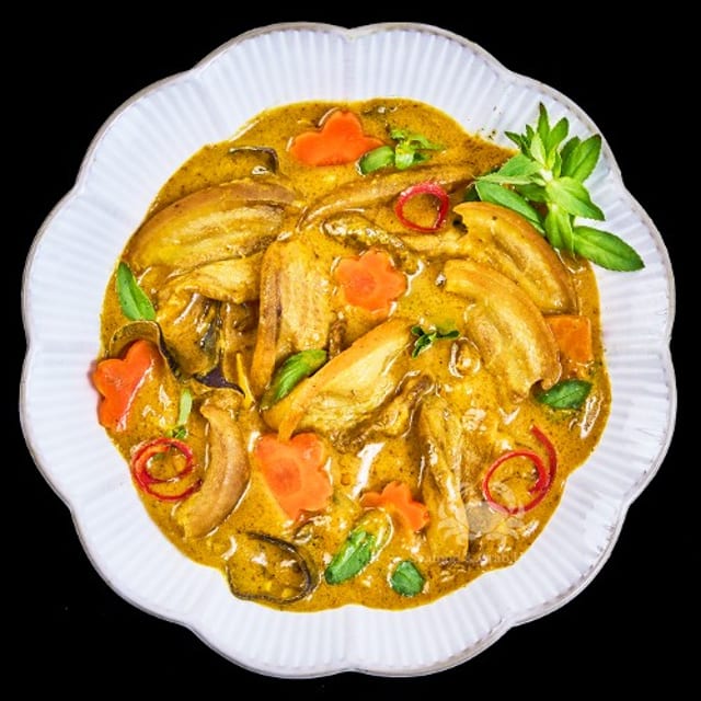 Dê Xào Lăn / Sautéed in Curry, Turmeric, and Coconut Milk.